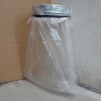 Round wall-mounted galvanised steel bin bag holder.