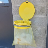 Yellow outdoor recycling bin