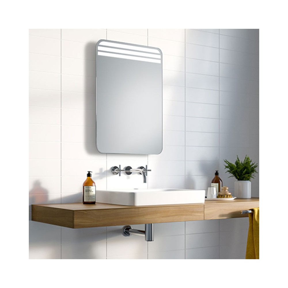 Mirror with rounded corners and triple LED for optimal lighting.