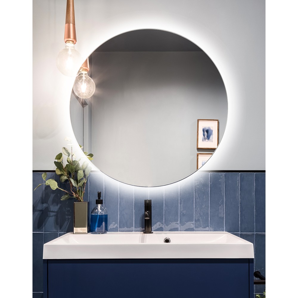 Round mirror with integrated backlighting for ambient lighting